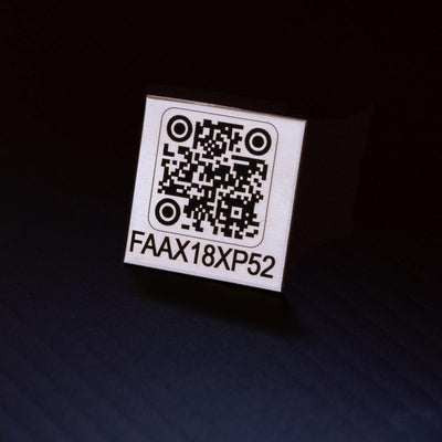 Drone tag made from stainless steel and laser engraved with FAA registration number.
